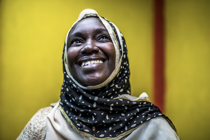 smiling woman with headscarf